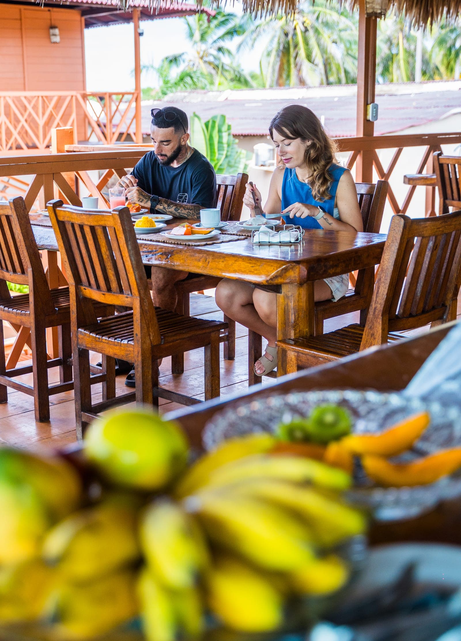 Couple having breakfast on the veranda