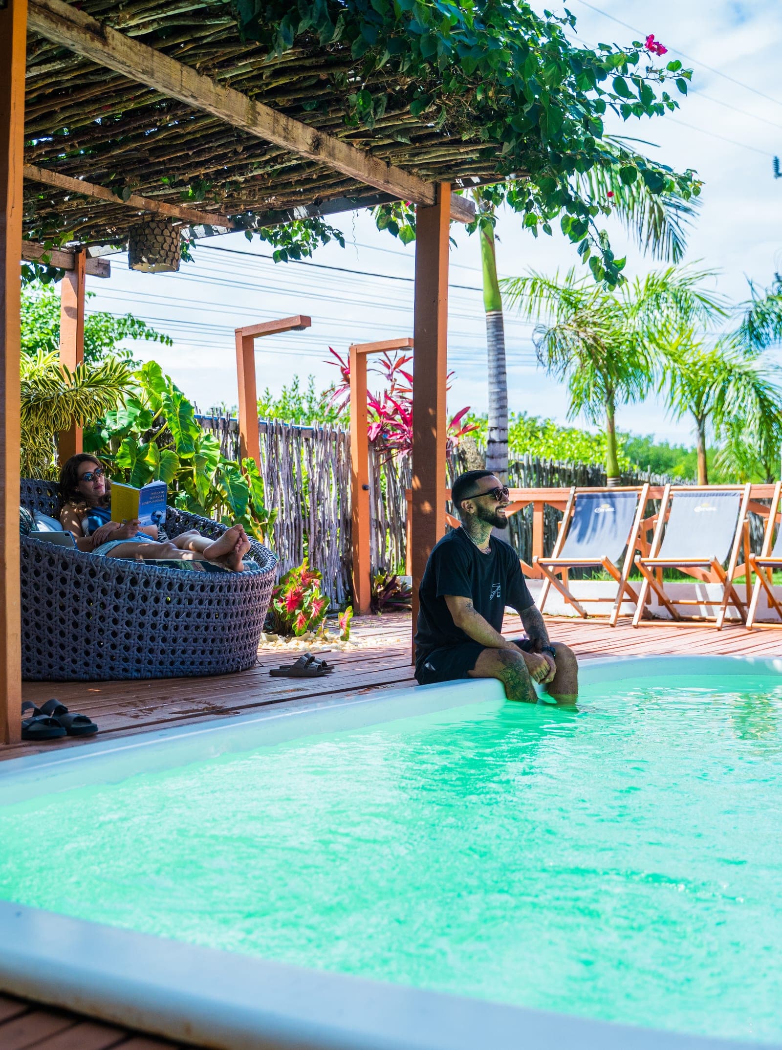 Couple relaxing by the pool