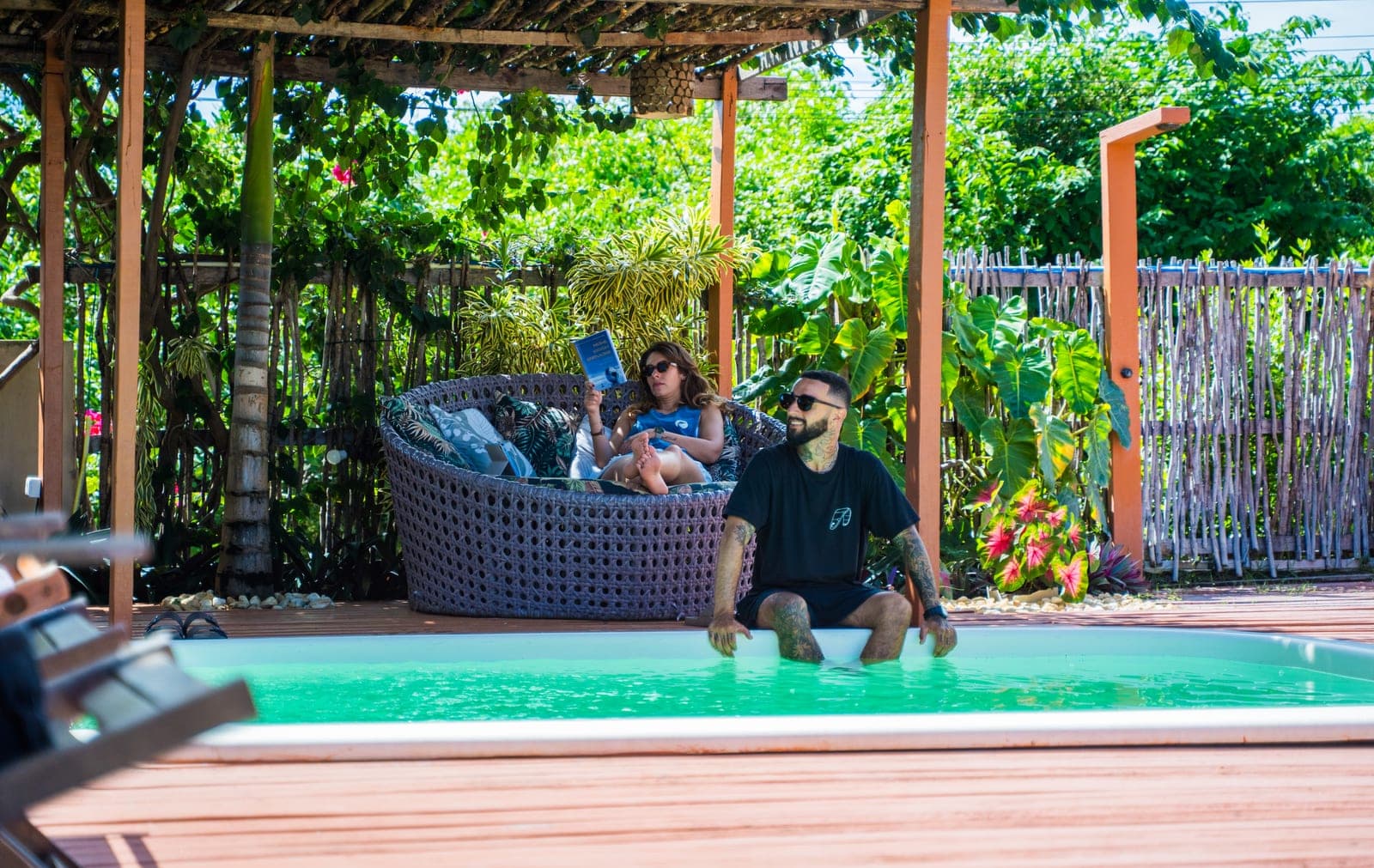 Couple enjoying the pool and garden