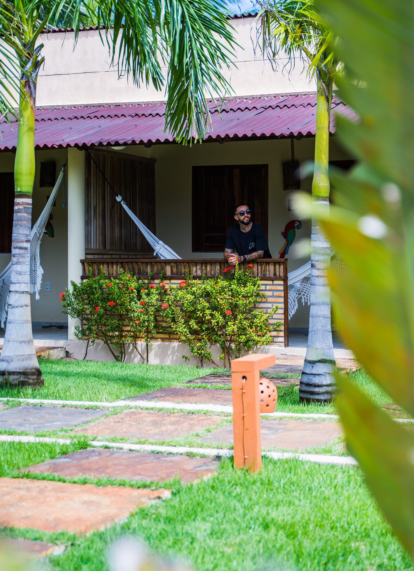 Guest on the suite veranda surrounded by the garden